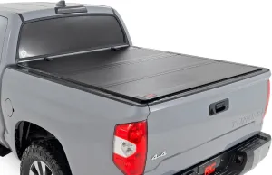 Rough Country Hard Tri-Fold Flip Up Truck Bed Tonneau Cover for Toyota Tundra (2007-2021) - Fits 5'7 Bed, All-Weather, Flush Aluminum Panels
